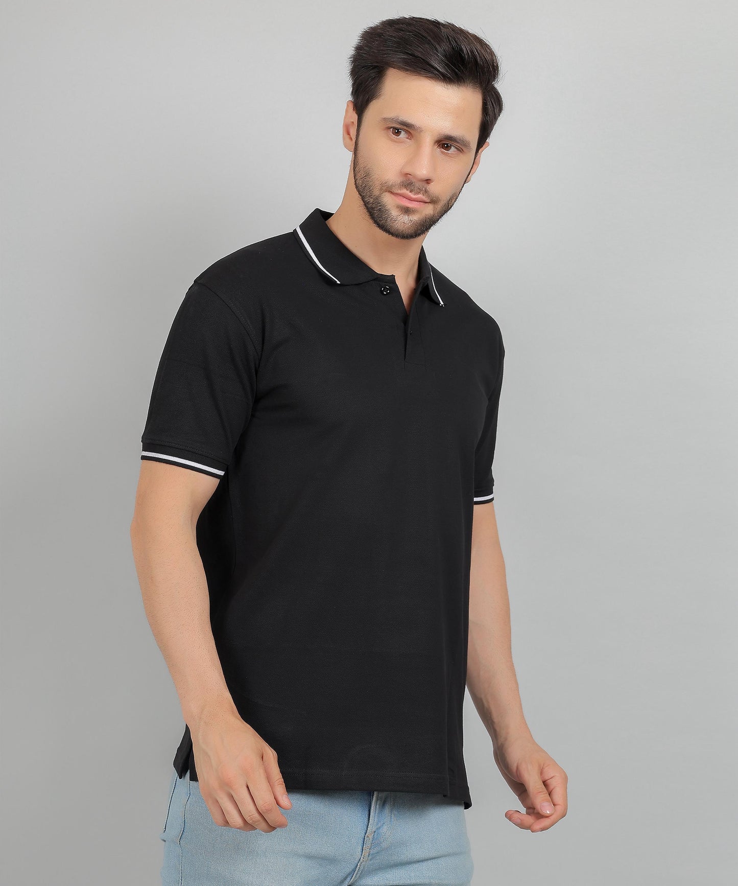 Model wearing black polo t‑shirt with smart casual look