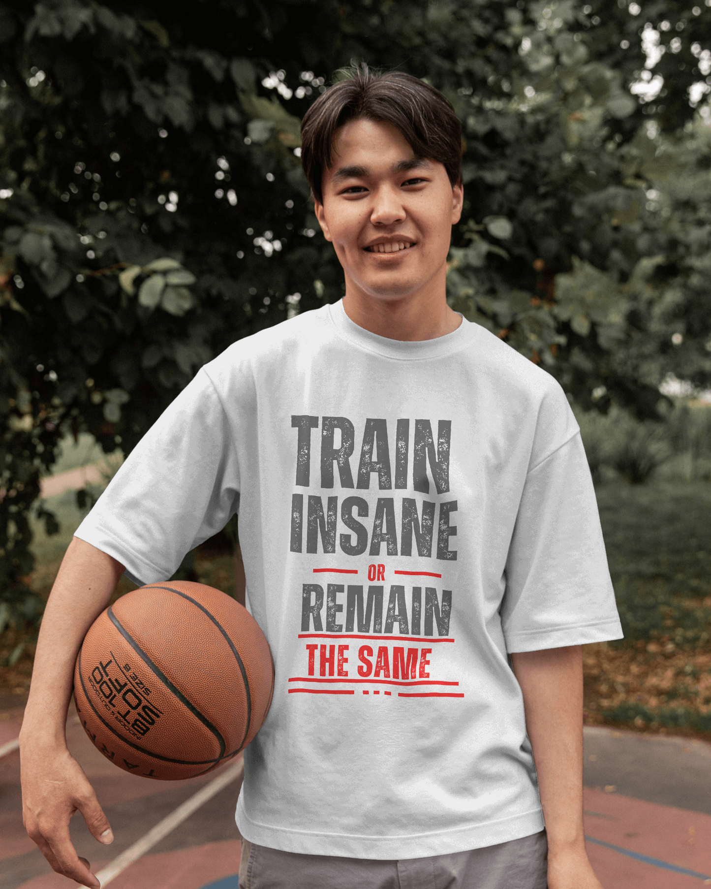 Model wearing white Train oversized t‑shirt with drop shoulder style