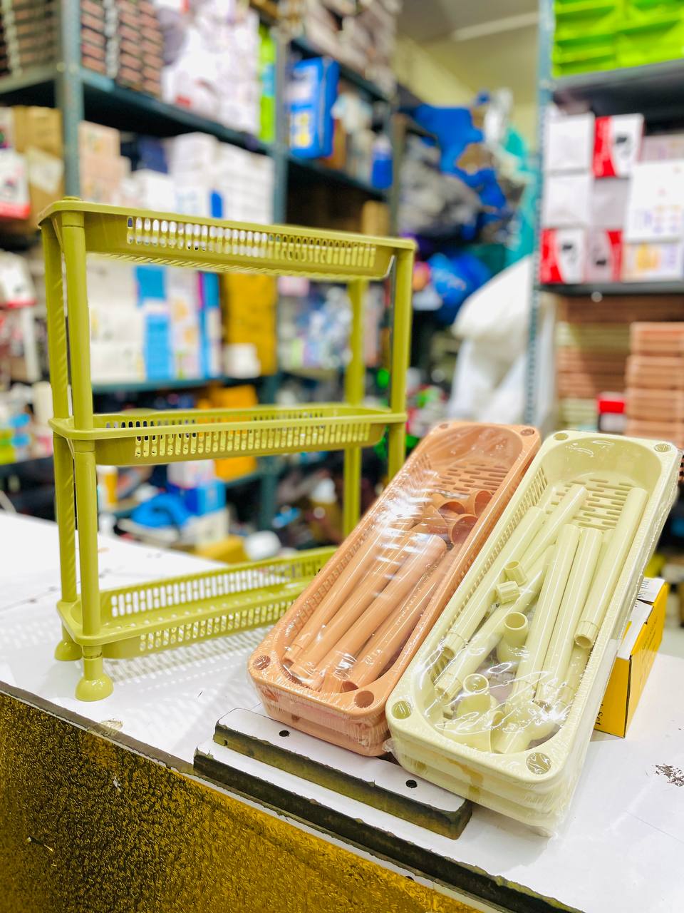 3-tier plastic storage rack with ventilated trays and caster wheels
