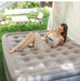 Single-size inflatable air mattress with integrated electric pump for camping or guest use