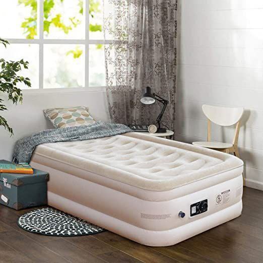 Inflated single air mattress set up inside a tent