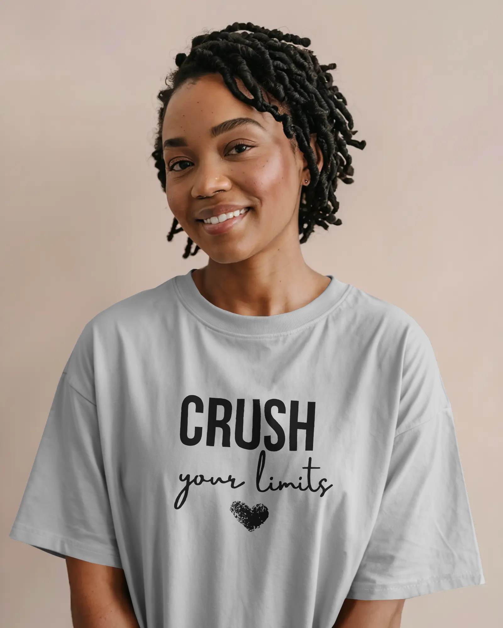 Model wearing white Crush oversized t‑shirt with drop shoulder style