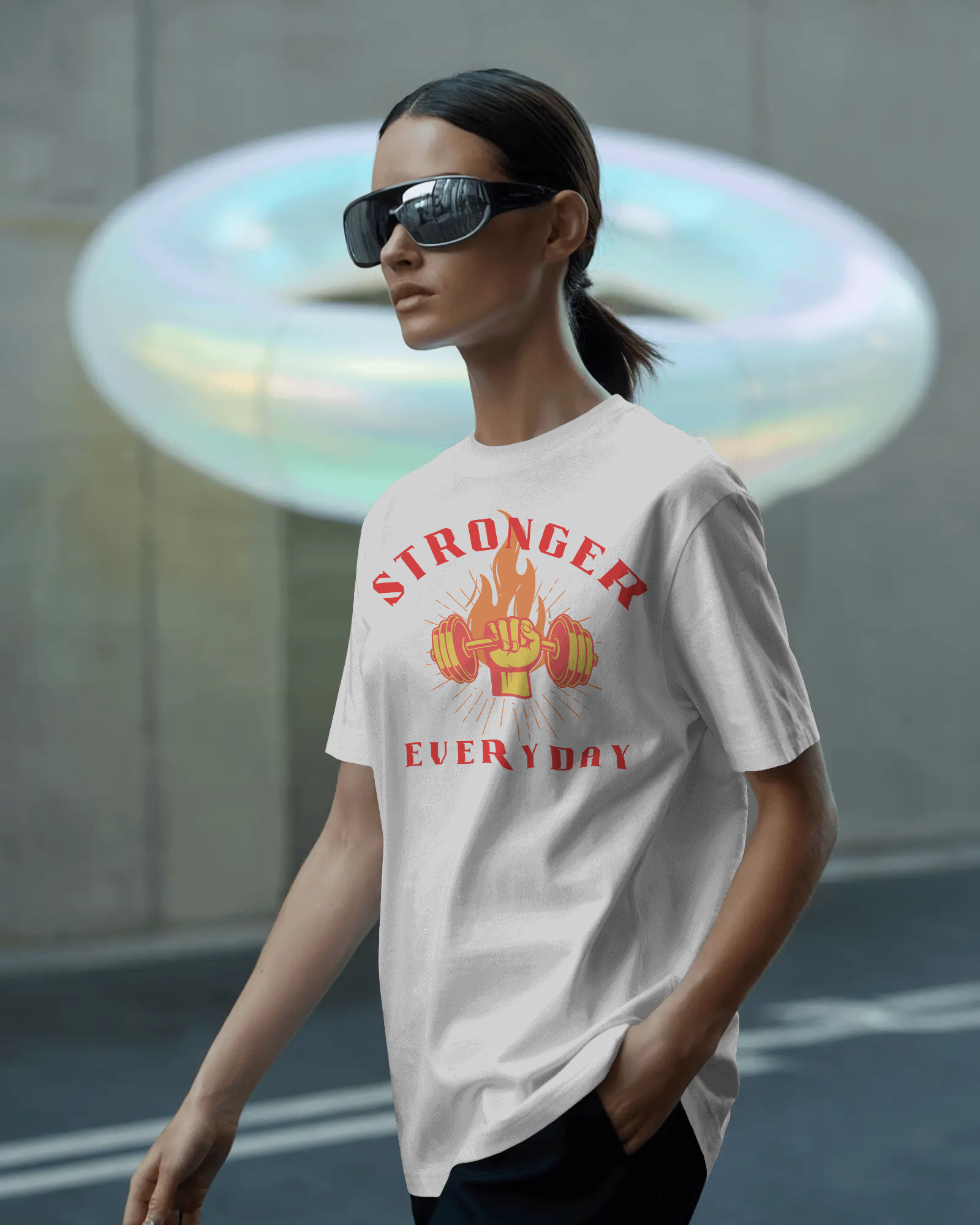 Model wearing white Strong oversized t‑shirt with drop shoulder design


